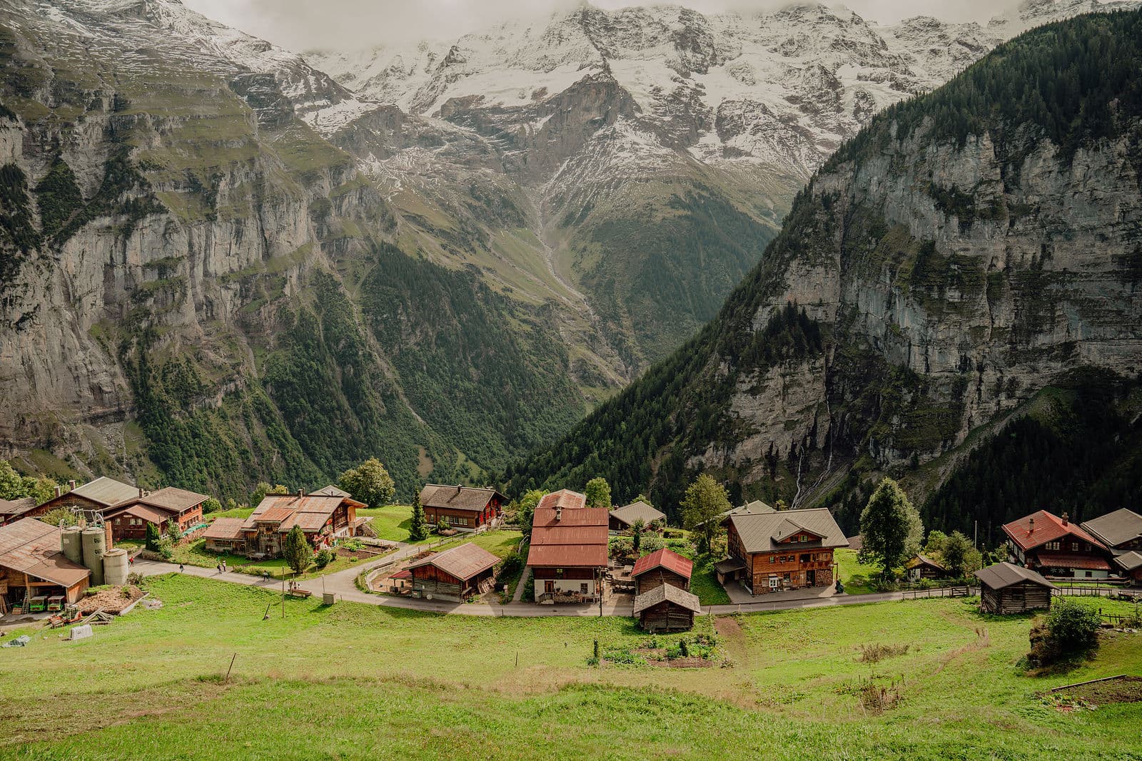 Scenic view of Grindelwald village and surrounding mountains